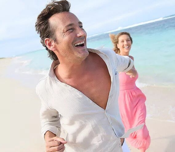 Couple running on beach